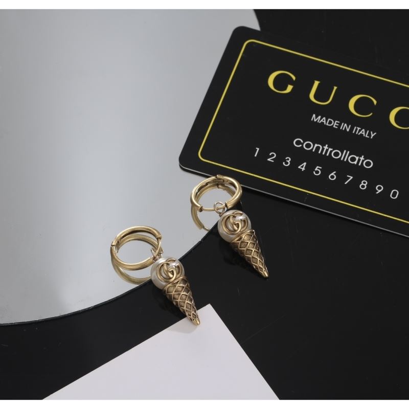 G*u*i earrings
